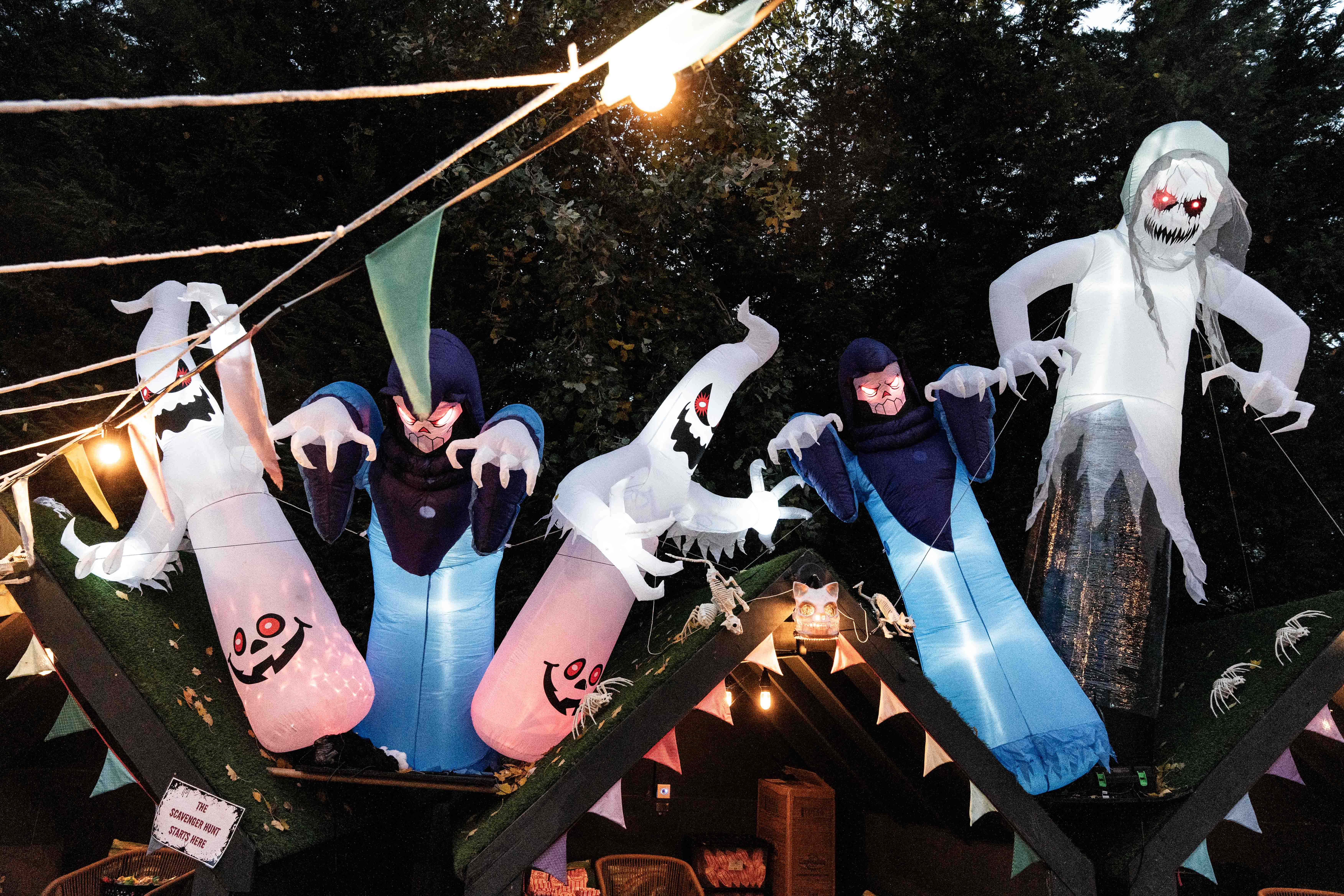 Large inflatable Halloween decorations with ghosts and monsters